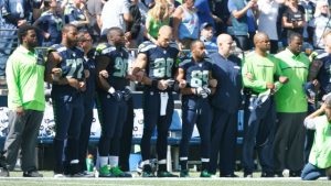 SEATTLE, WA - SEPTEMBER 11: Members of the Seattle Seahawks are seen together during the playing of the National Anthem before the start of an NFL game against the Miami Dolphins at CenturyLink Field on September 11, 2016 in Seattle, Washington. (Photo by Otto Greule Jr/Getty Images)