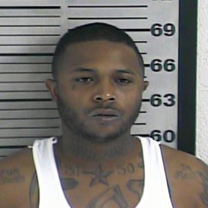 In this photo made available by the Dyer County Sheriff's Office, Tenn., on Friday, Nov. 18, 2016, shows Torius Russell under arrest. Authorities accuse Russell of fatally shooting the mother of a 2-year-old during the child's birthday party in Dyersburg, Tenn., Thursday, Nov. 17, 2016. (Dyer County Sheriff's Office via AP)