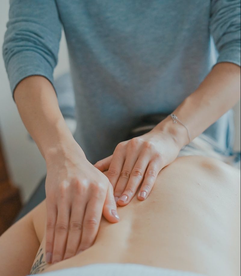 man massaging woman's body