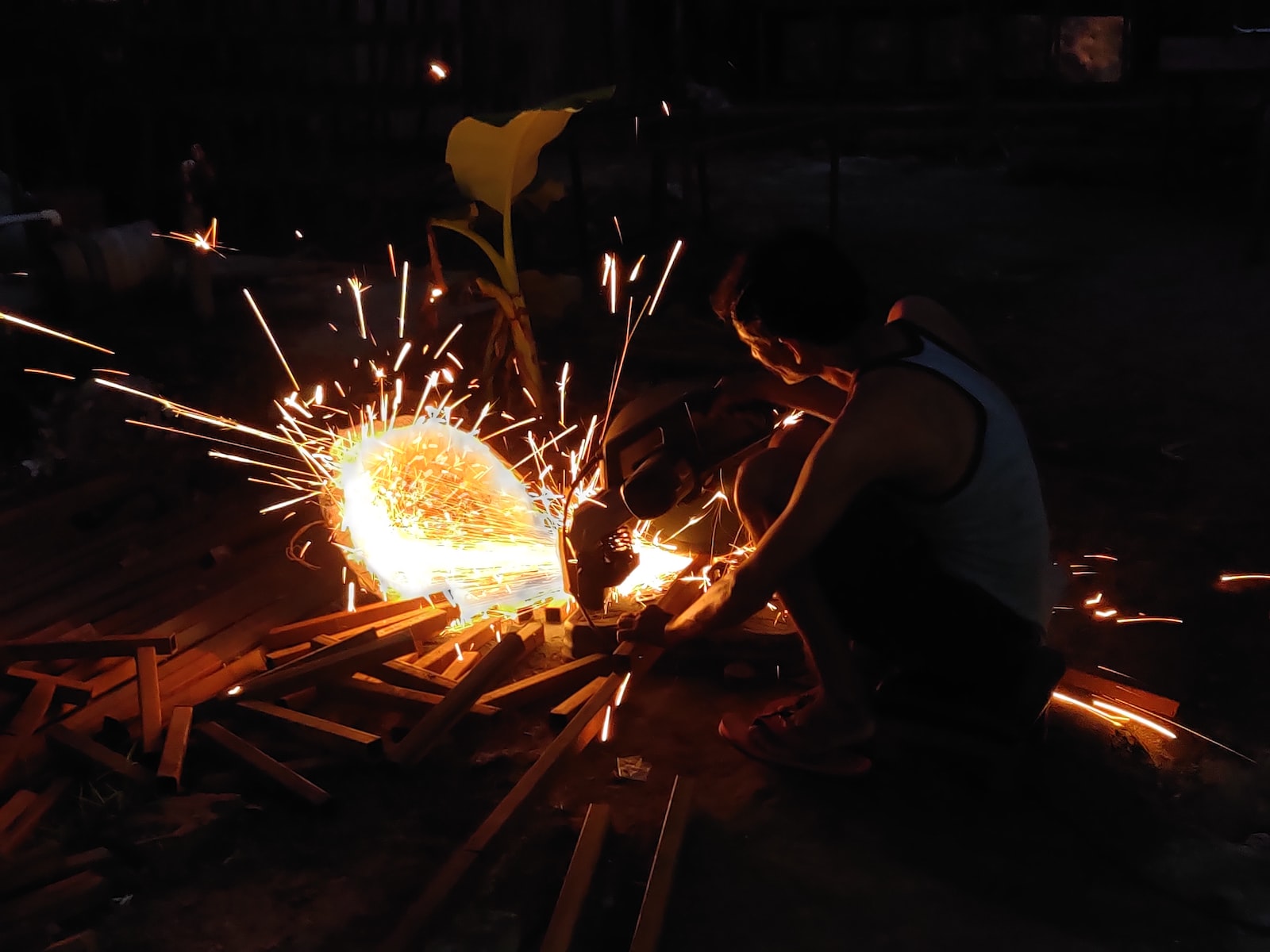 man in gray t-shirt holding sparkler