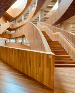 brown wooden spiral staircase with brown wooden railings