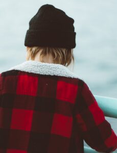 woman in red and black knit sweater