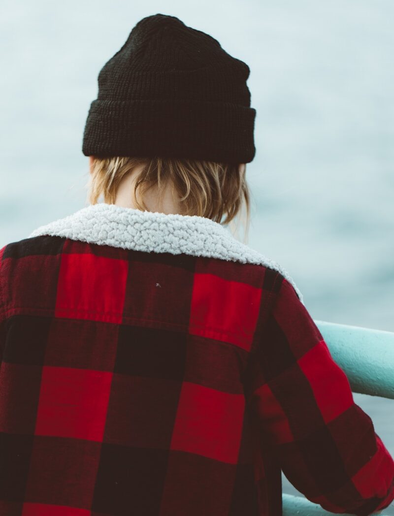 woman in red and black knit sweater